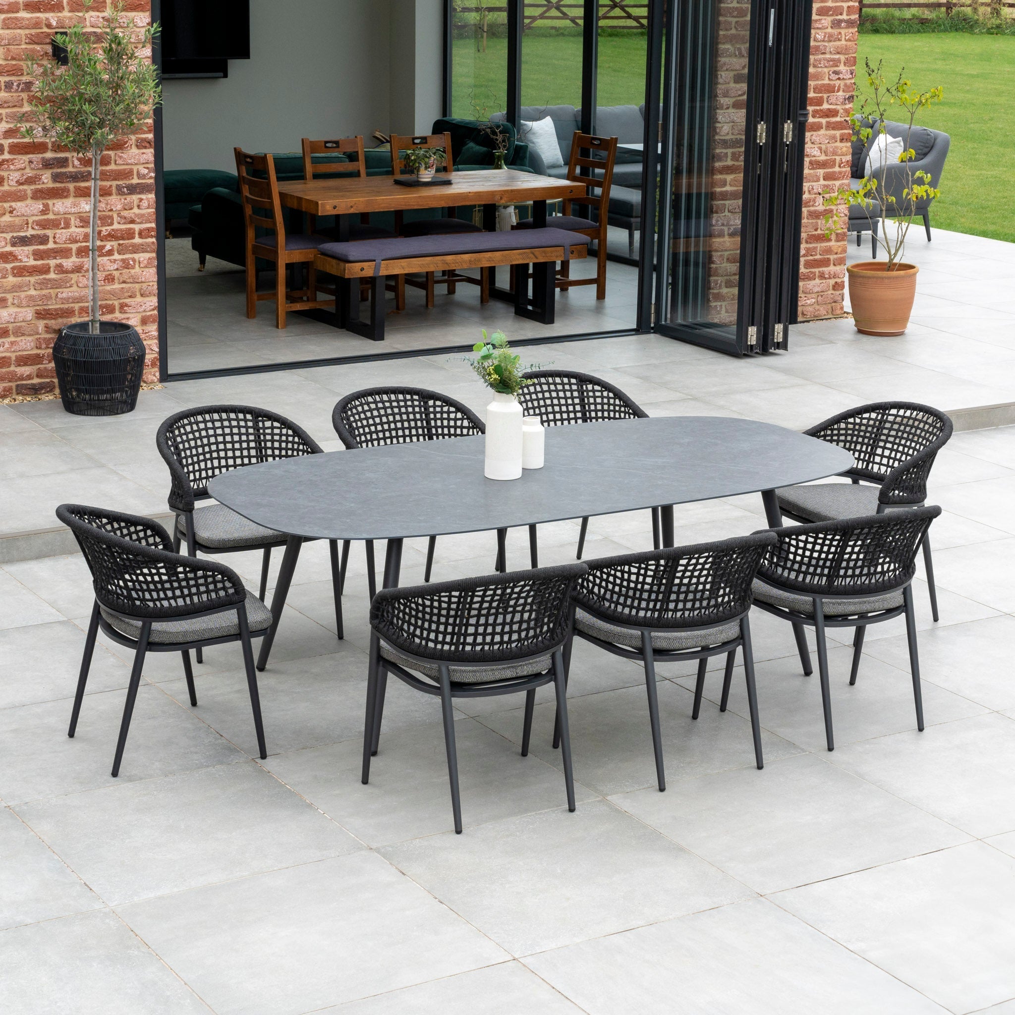 Kalama 8 Seat Rope Oval Dining Set with Ceramic Table in Charcoal