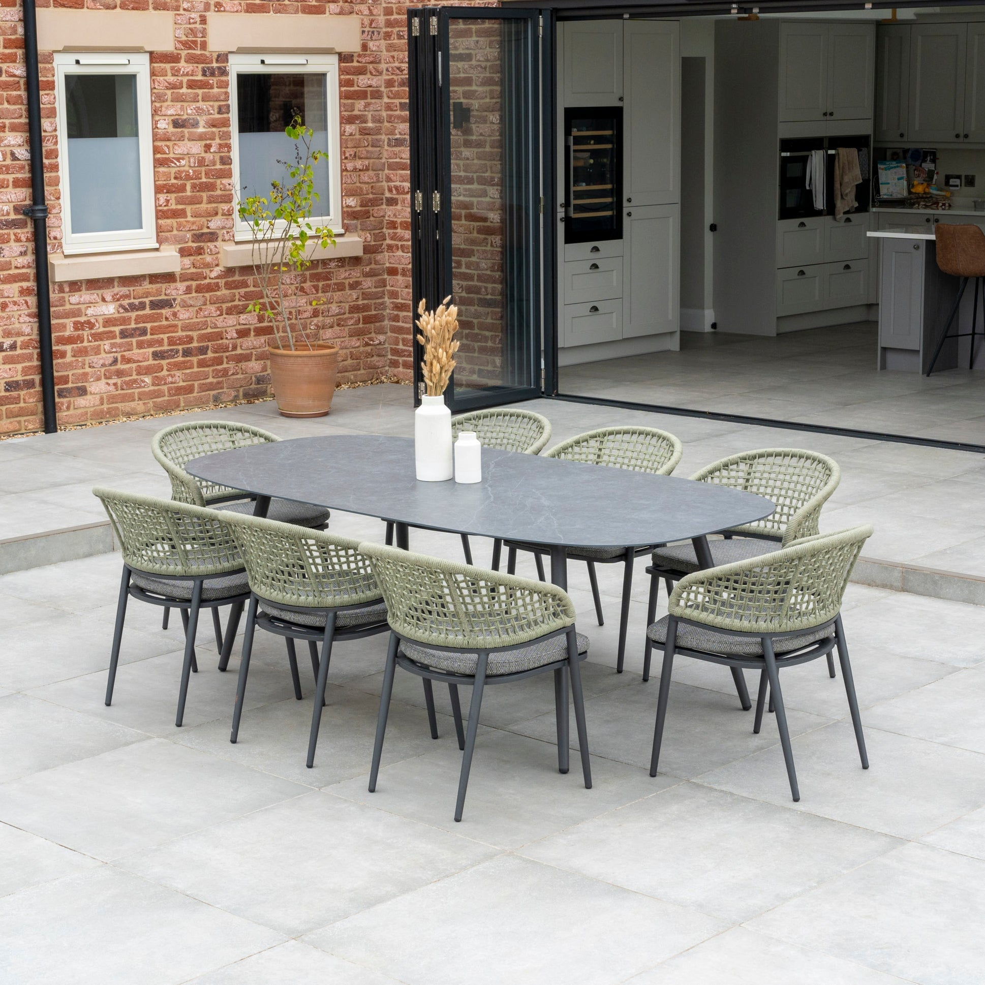 Kalama 8 Seat Rope Oval Dining Set with Ceramic Table in Olive Green