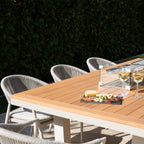 Cloverly 8 Seat Rectangular Teak Firepit Dining Set in Latte
