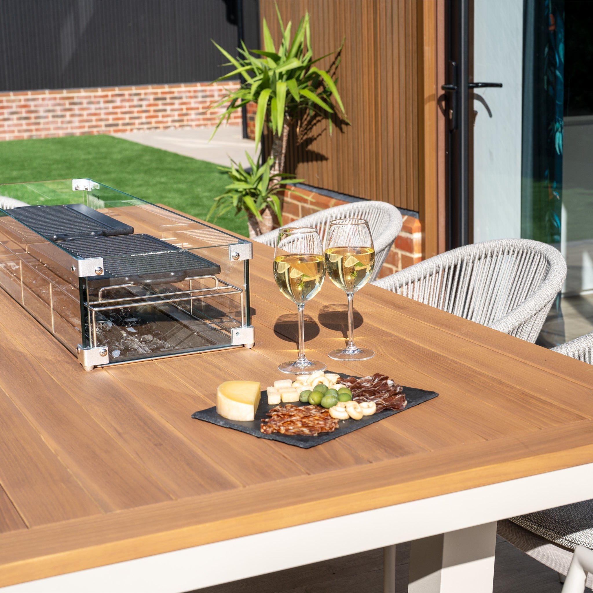 Cloverly 8 Seat Rectangular Teak Firepit Dining Set in Latte