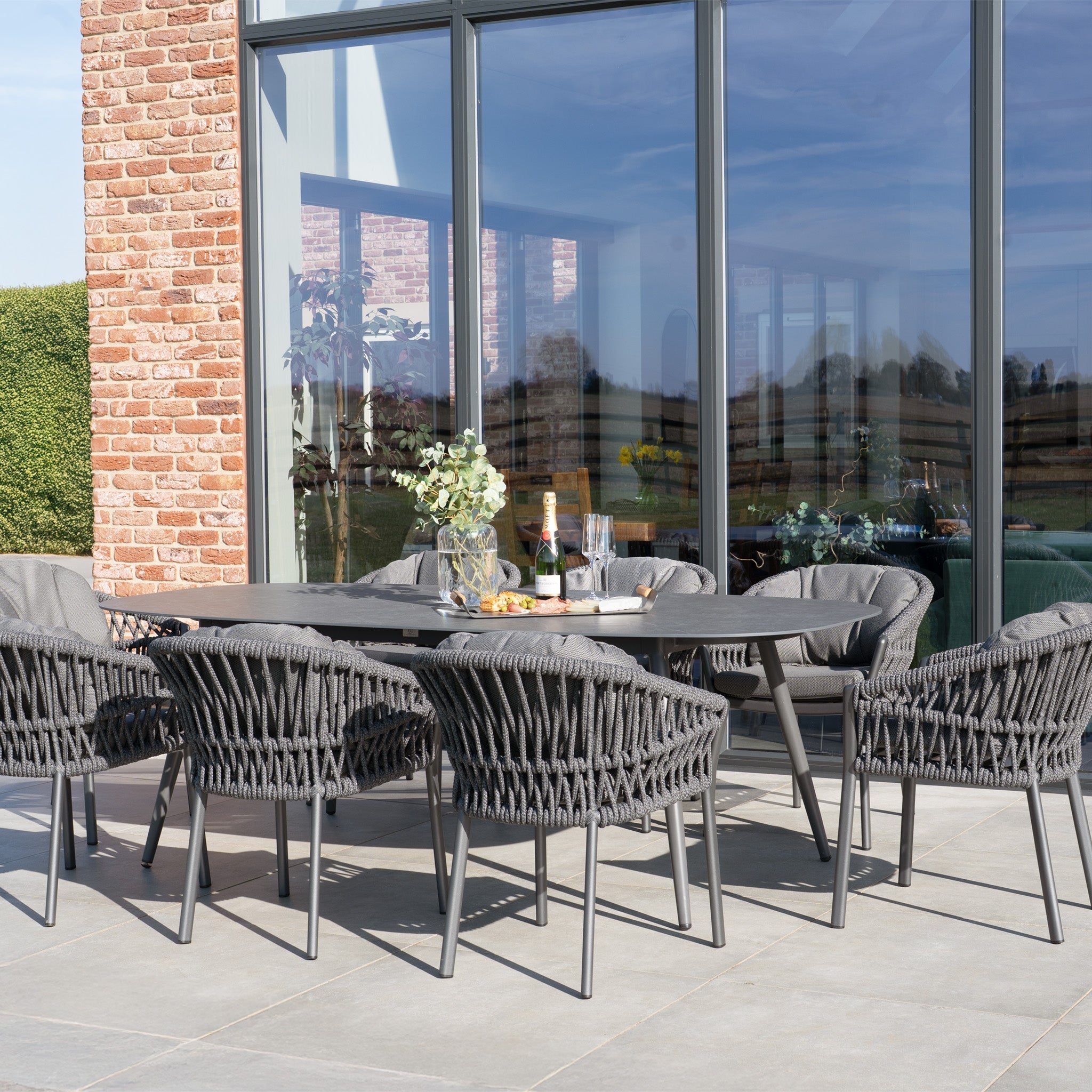 Pello 8 Seat Oval Dining Set with Ceramic Table in Grey