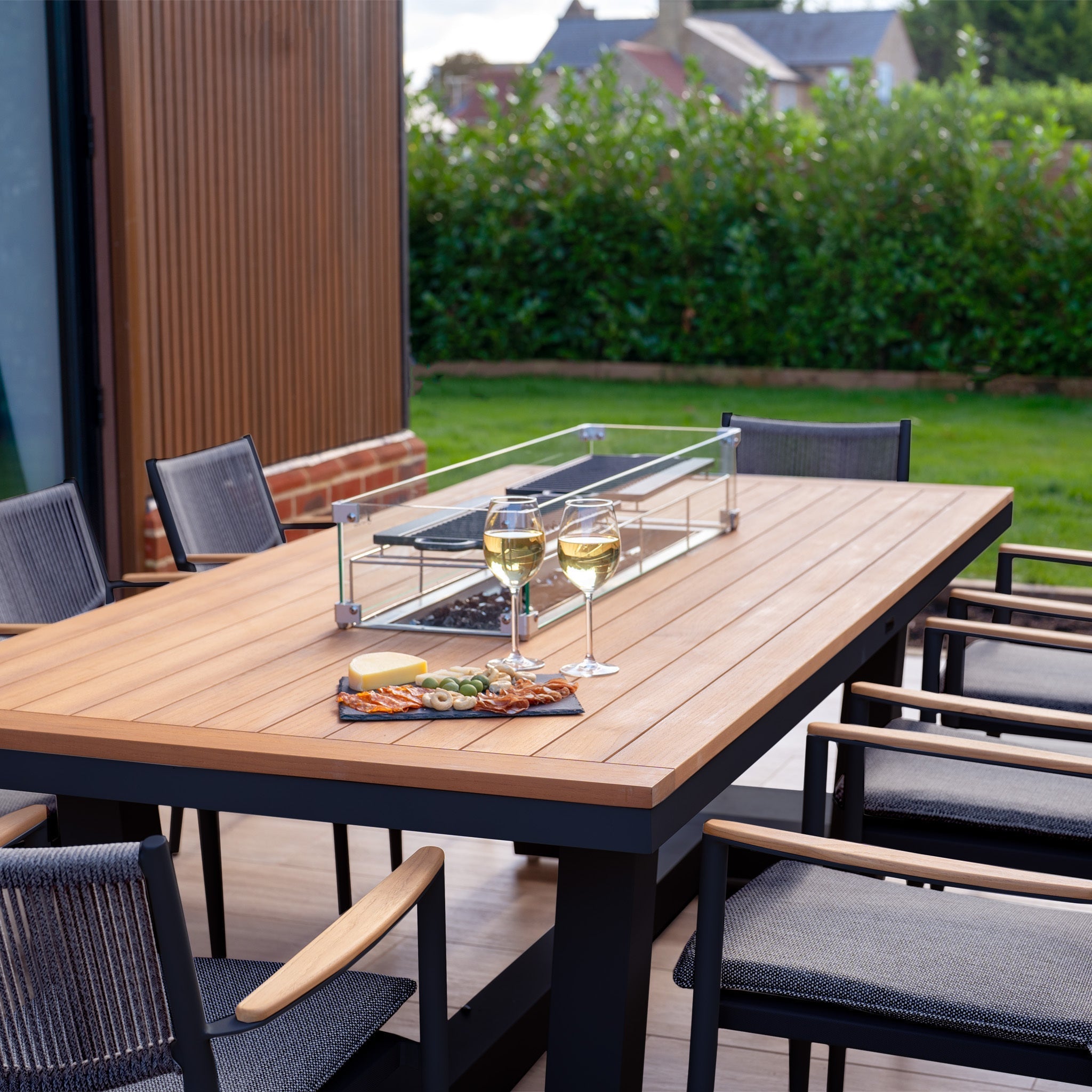 Tellaro 8 Seat Rectangular Teak Firepit Dining Set in Charcoal