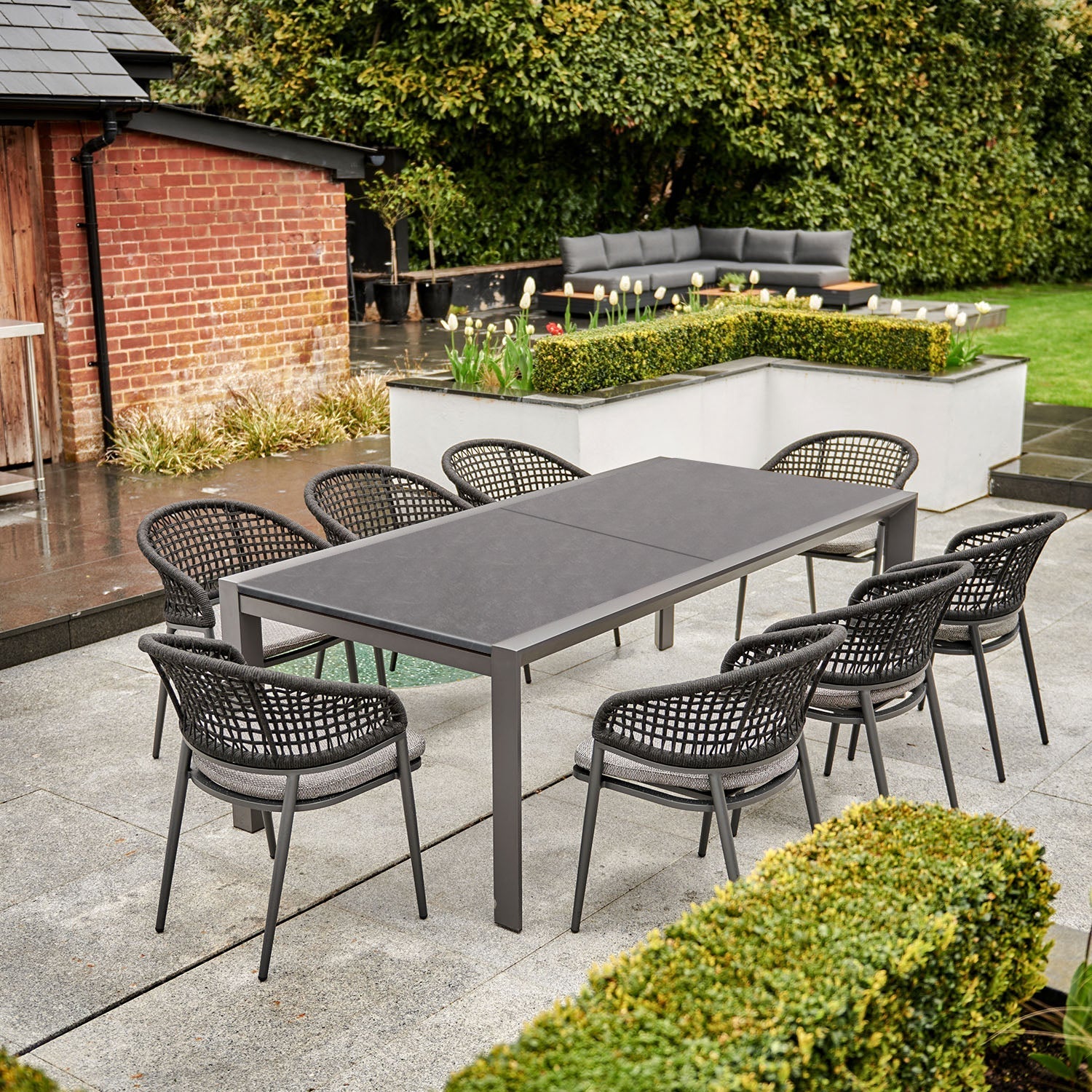Kalama 10 Seat Rectangular Extending Dining Set with Ceramic Table in Charcoal